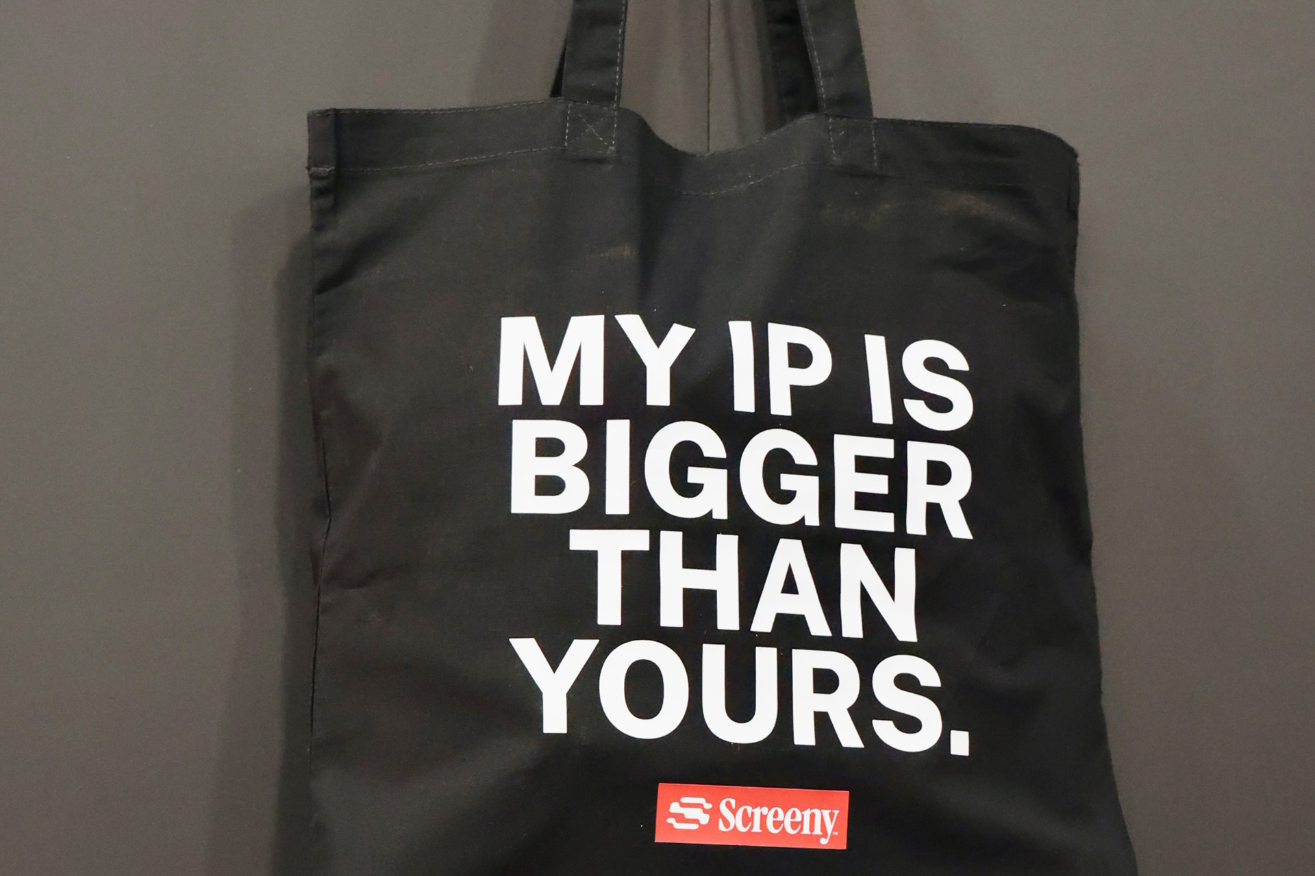 Black Screeny tote bag printed "MY IP IS BIGGER THAN YOURS."
